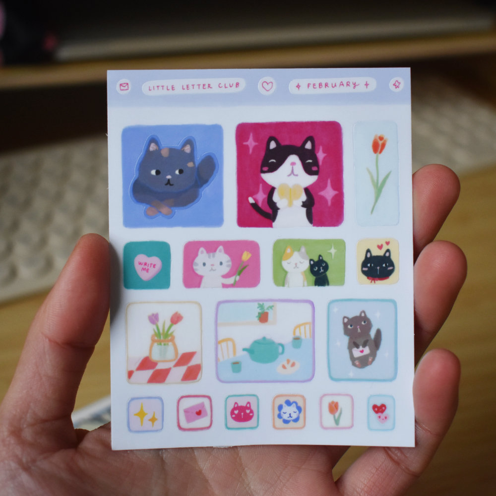 Closeup of stickers featuring cats and other cute characters