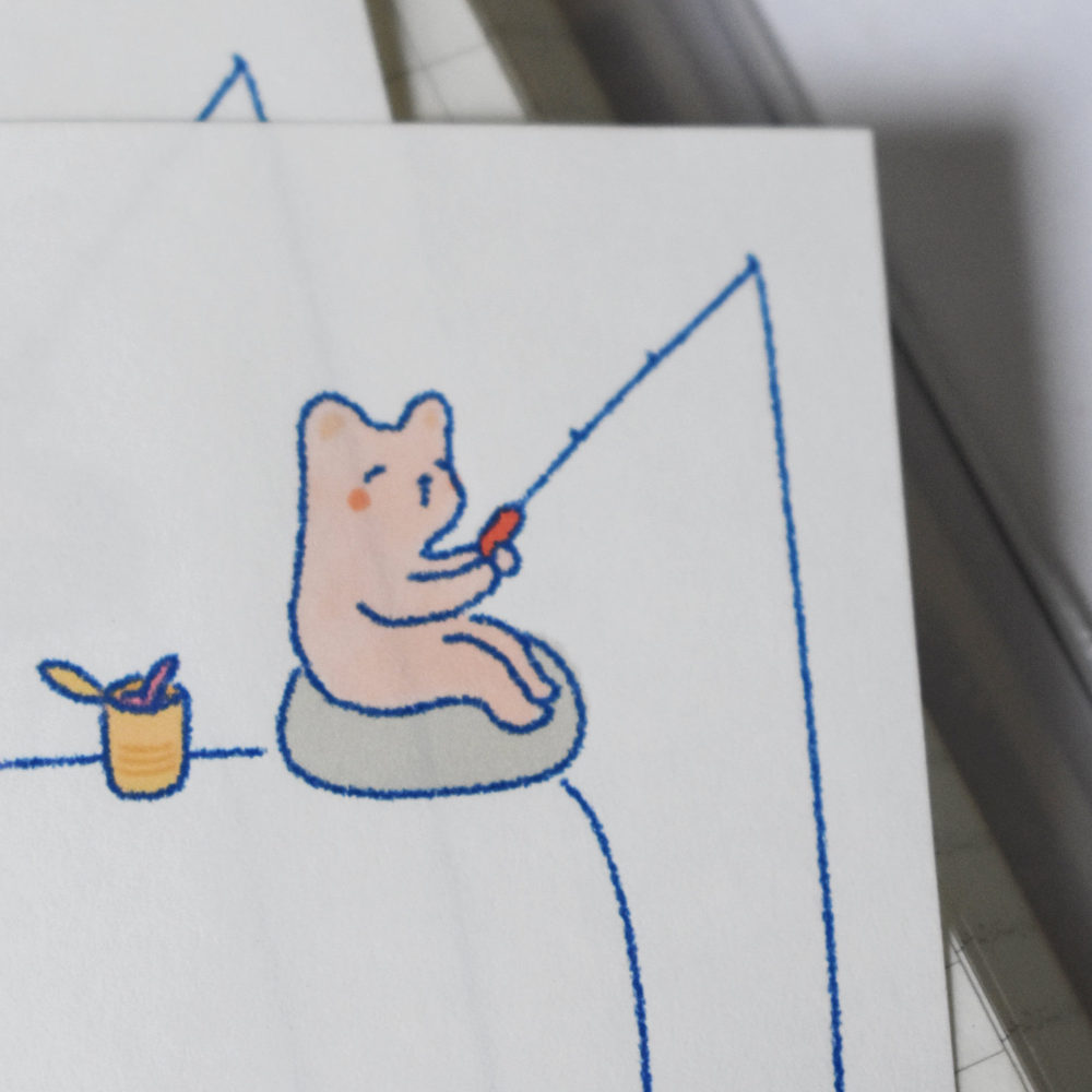 Closeup of stationery featuring cats making Valentines