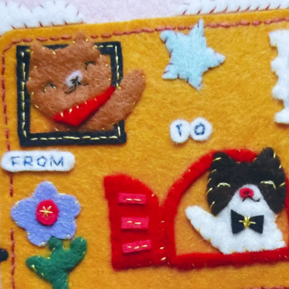 Closeup of stickers featuring cats made from felt